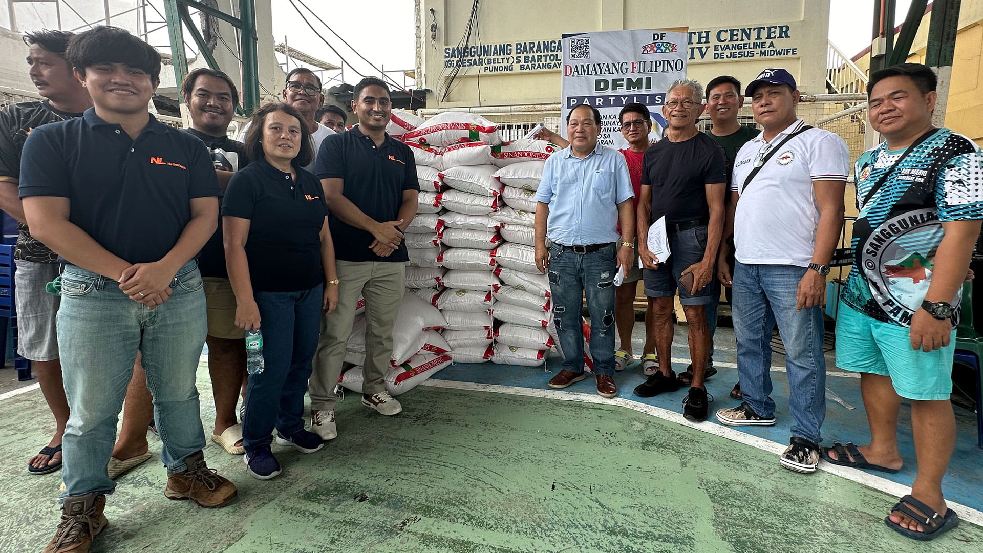 Our team handing over rice to village in Philippines
