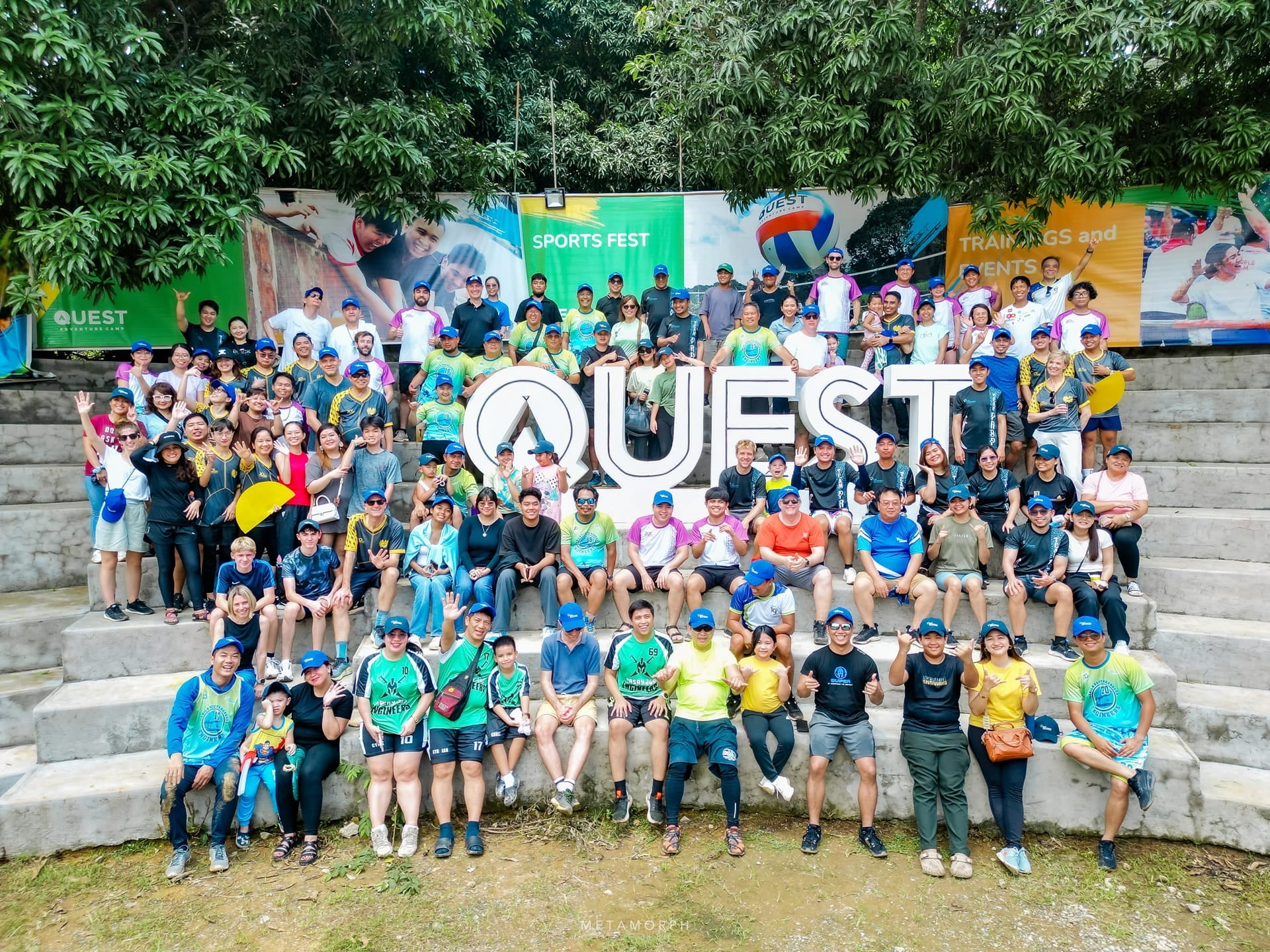 Group of people sitting together on a stairs