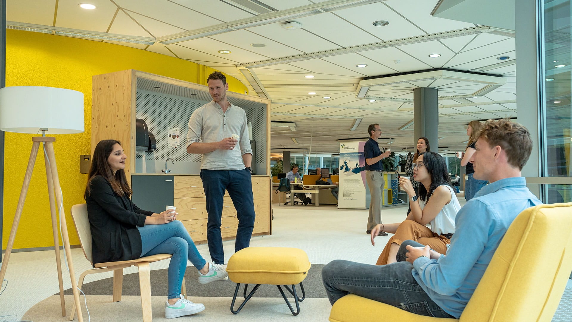 people at the office sitting down and having a conversation