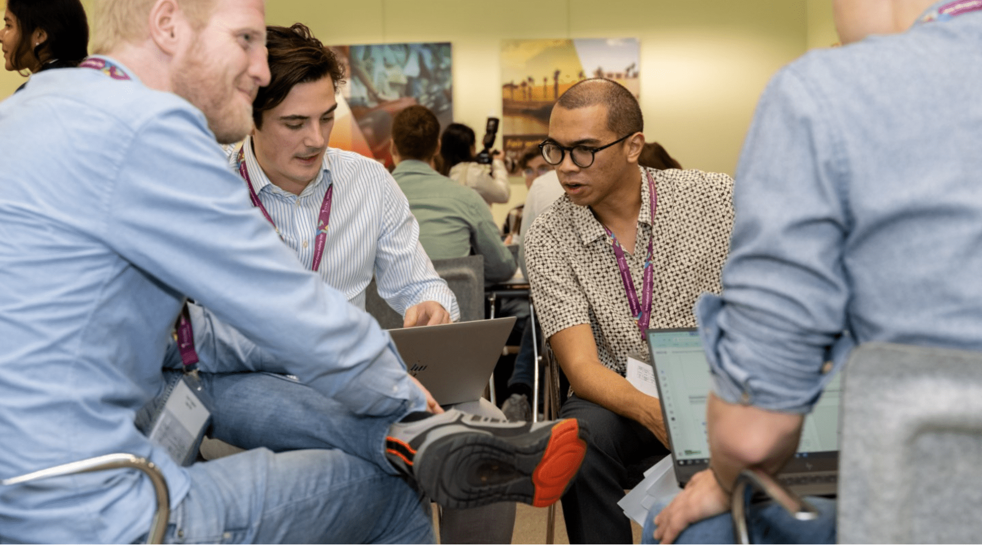 Four people sitting down and having a conversation