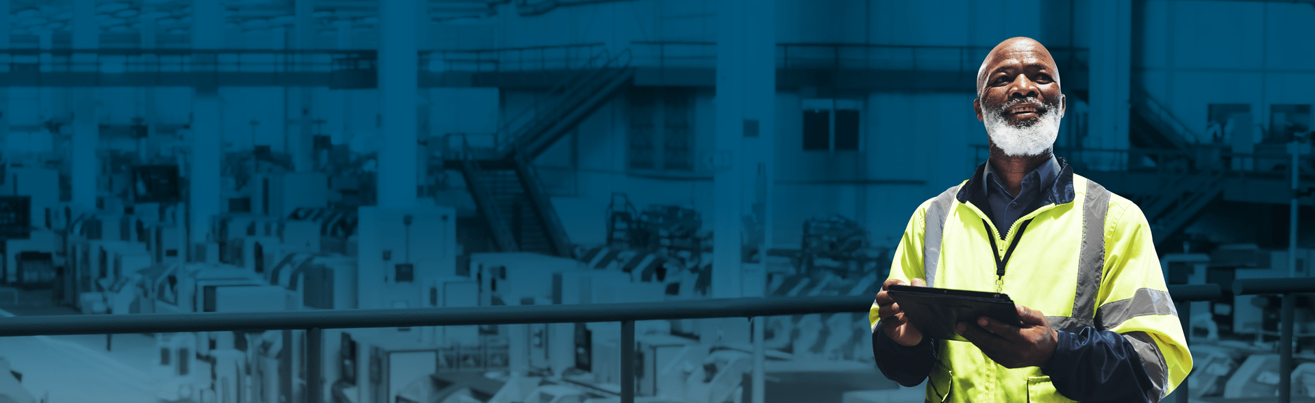 Industrial engineer in sustainable factory holding a tablet