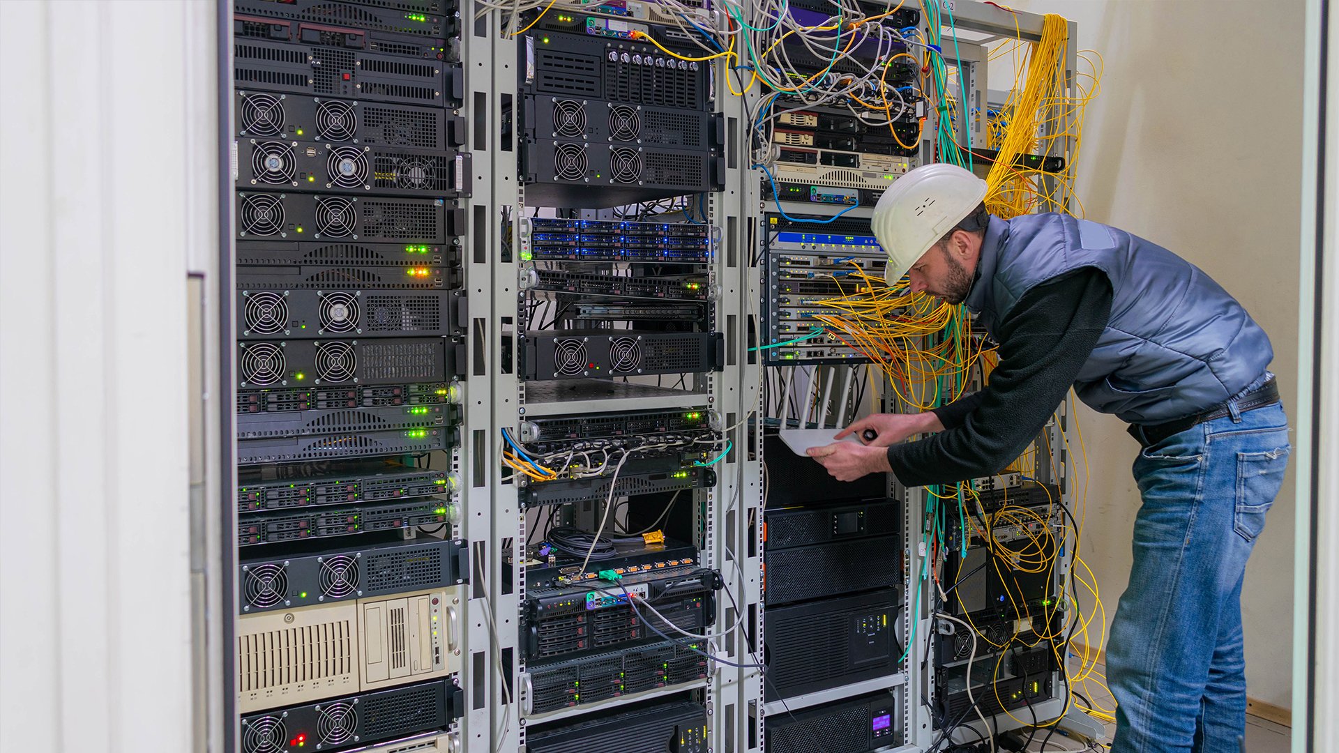 Engineer working on a data centre rack