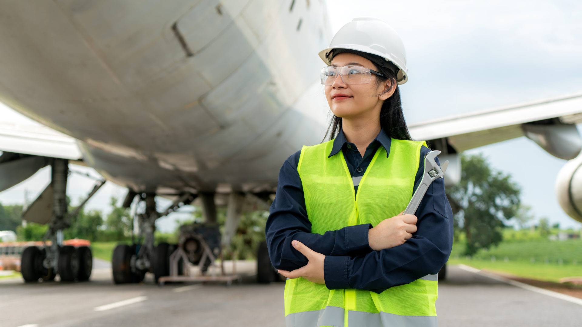 An operator stands in front of a large plane