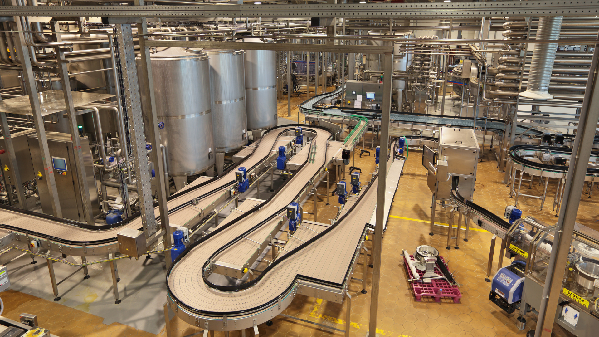 Conveyors inside a food and beverage plant.
