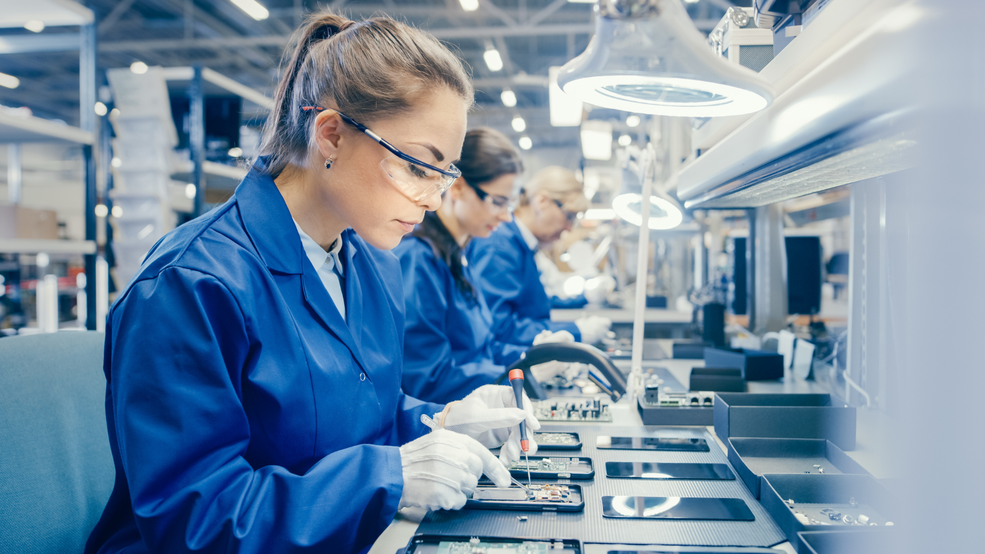 Workers on a high-tech electronics production line