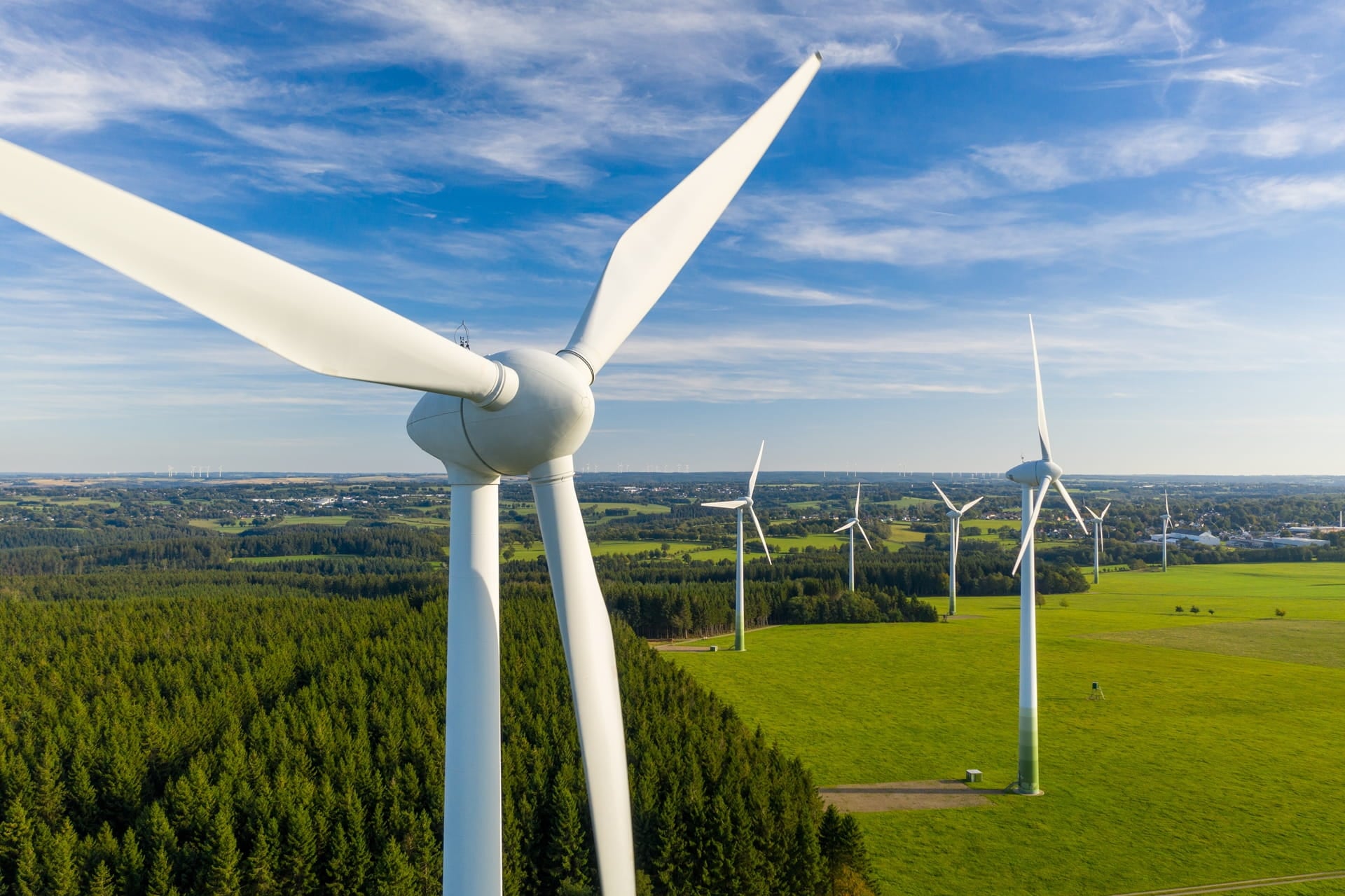 Wind turbines in green landscape