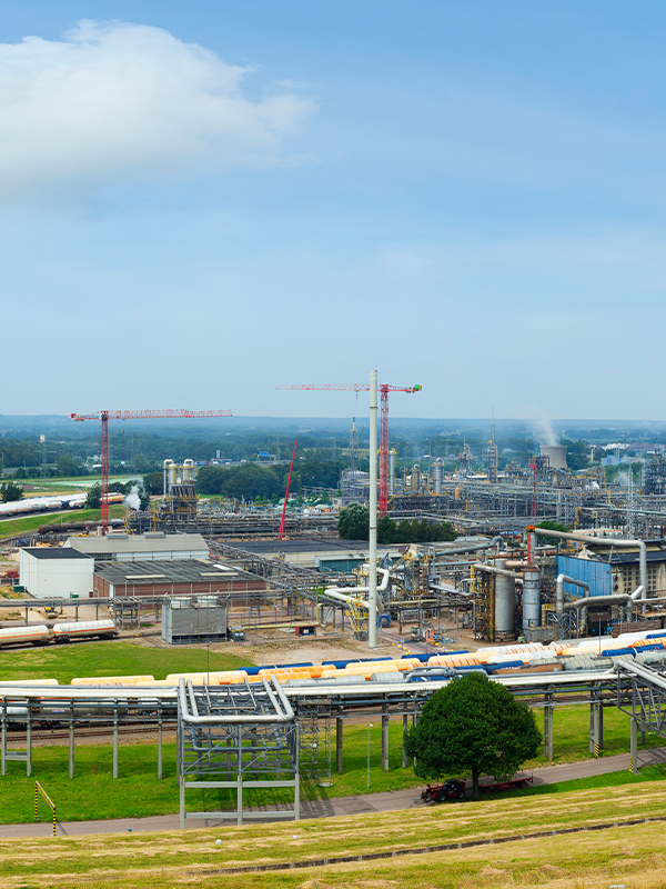 An aerial view of a chemical plant in the Netherlands, showcasing the expansive chemical logistics network and advanced infrastructure for asset life cycle management