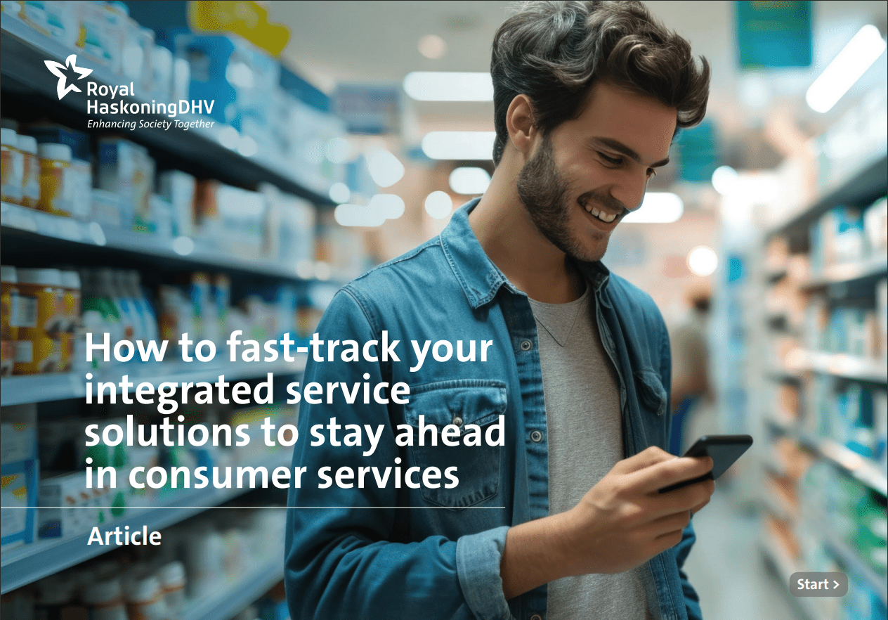 "A man smiling at his phone in a grocery store, illustrating the integration of food and beverage supply chain analytics with consumer services, and highlighting advancements in the retail and ecommerce industry.