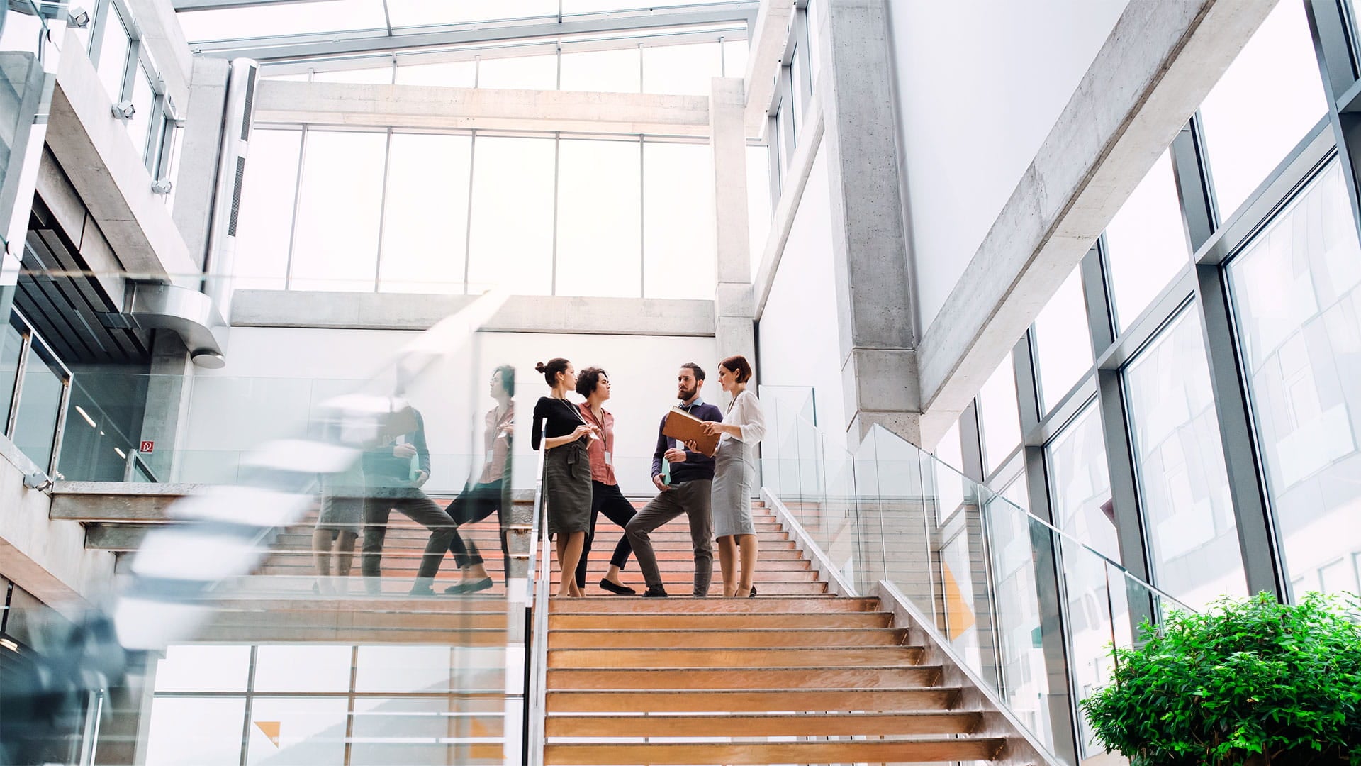 People walking on a staircase in a building