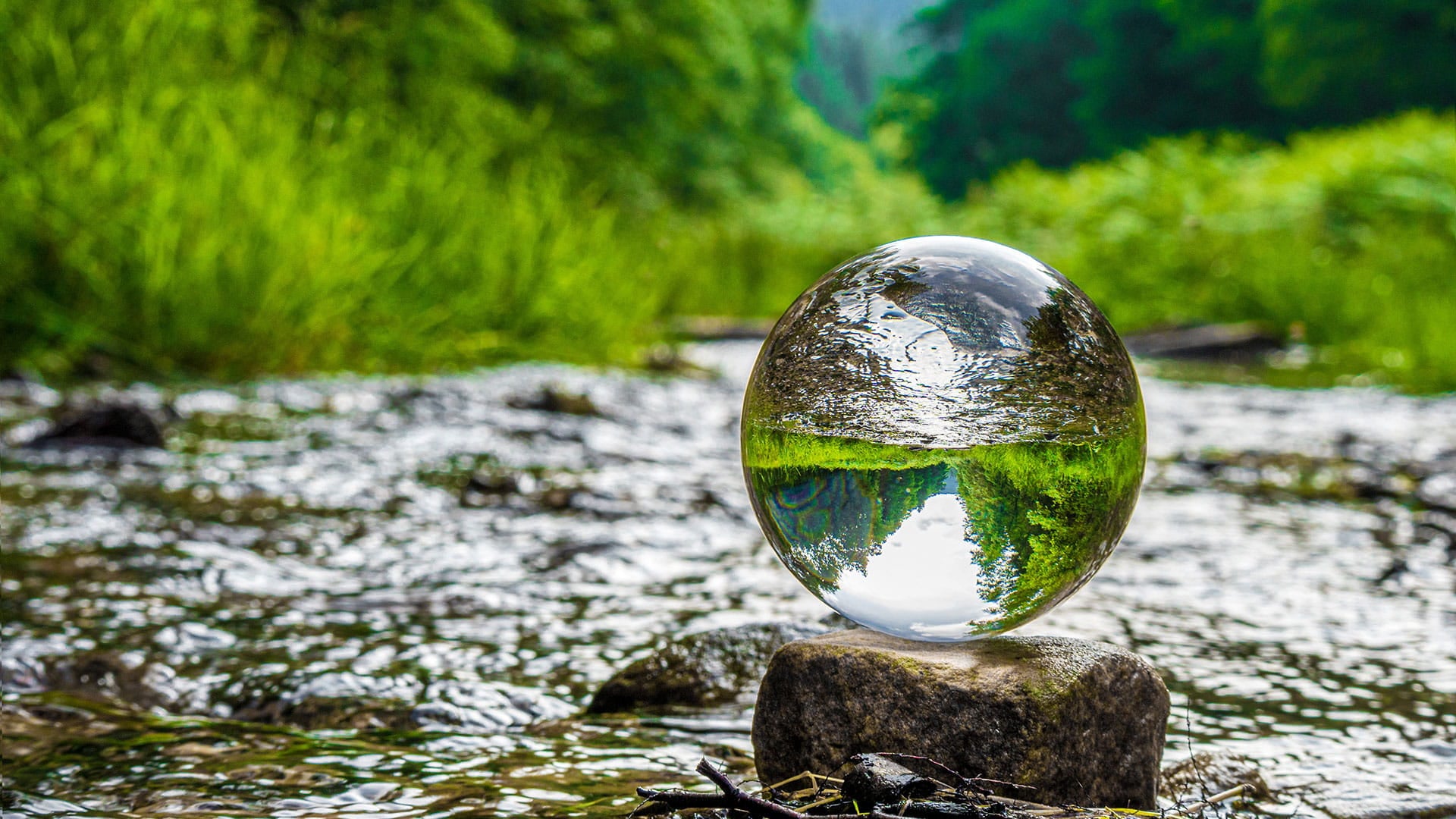 Water balloon in the middle of the river surrounded by the nature which represents becoming carbon neutral