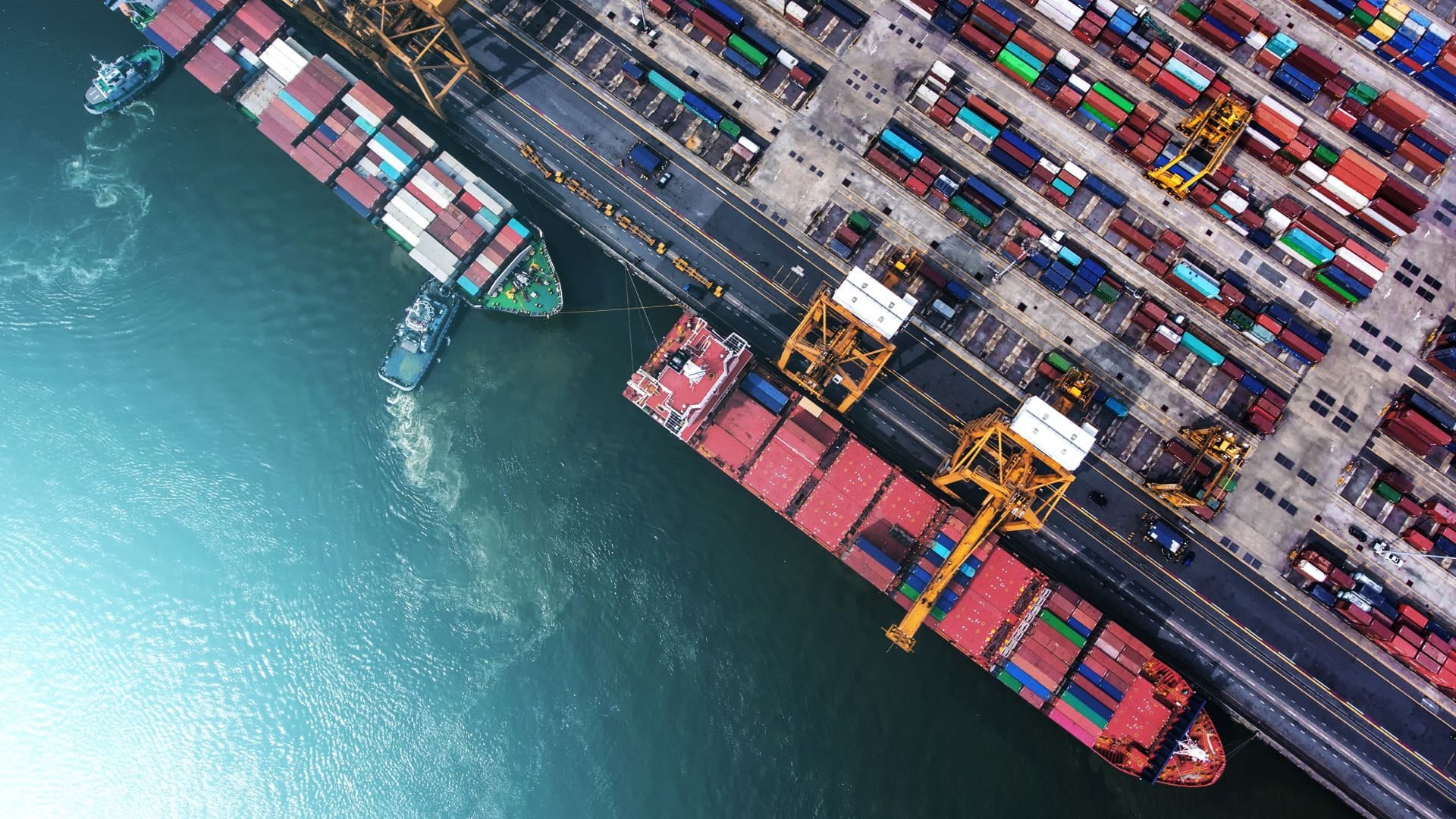 two container ships docked in the terminal birds eye view