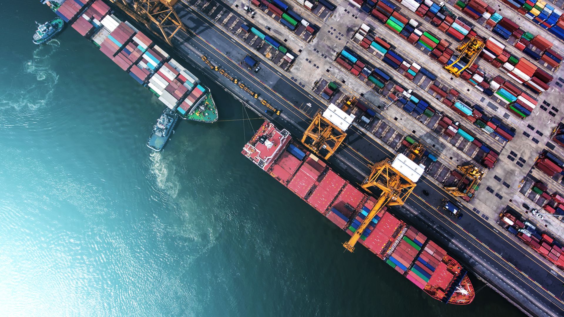 two container ships docked in the terminal birds eye view