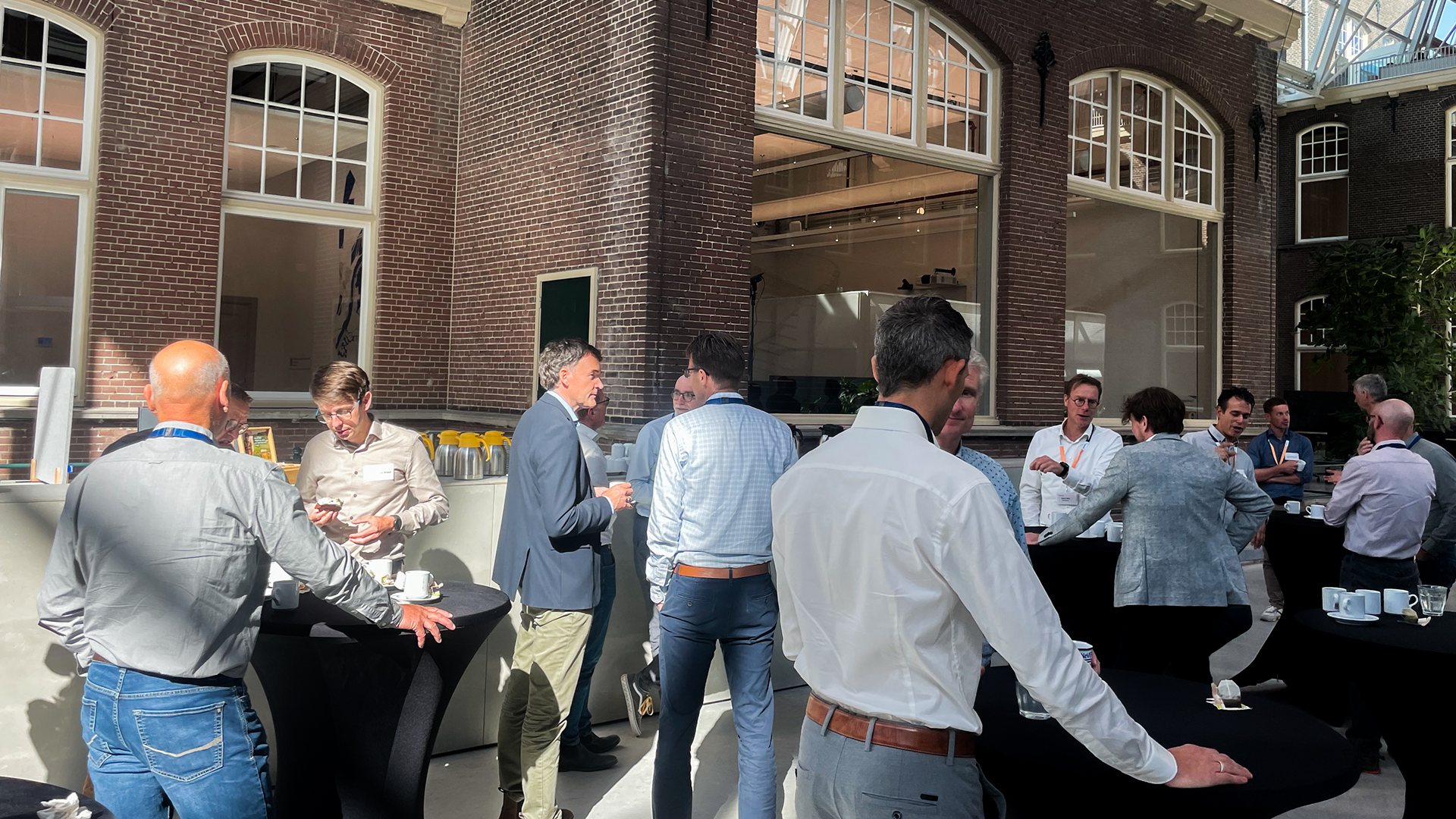 People in a break of the Industry seminar