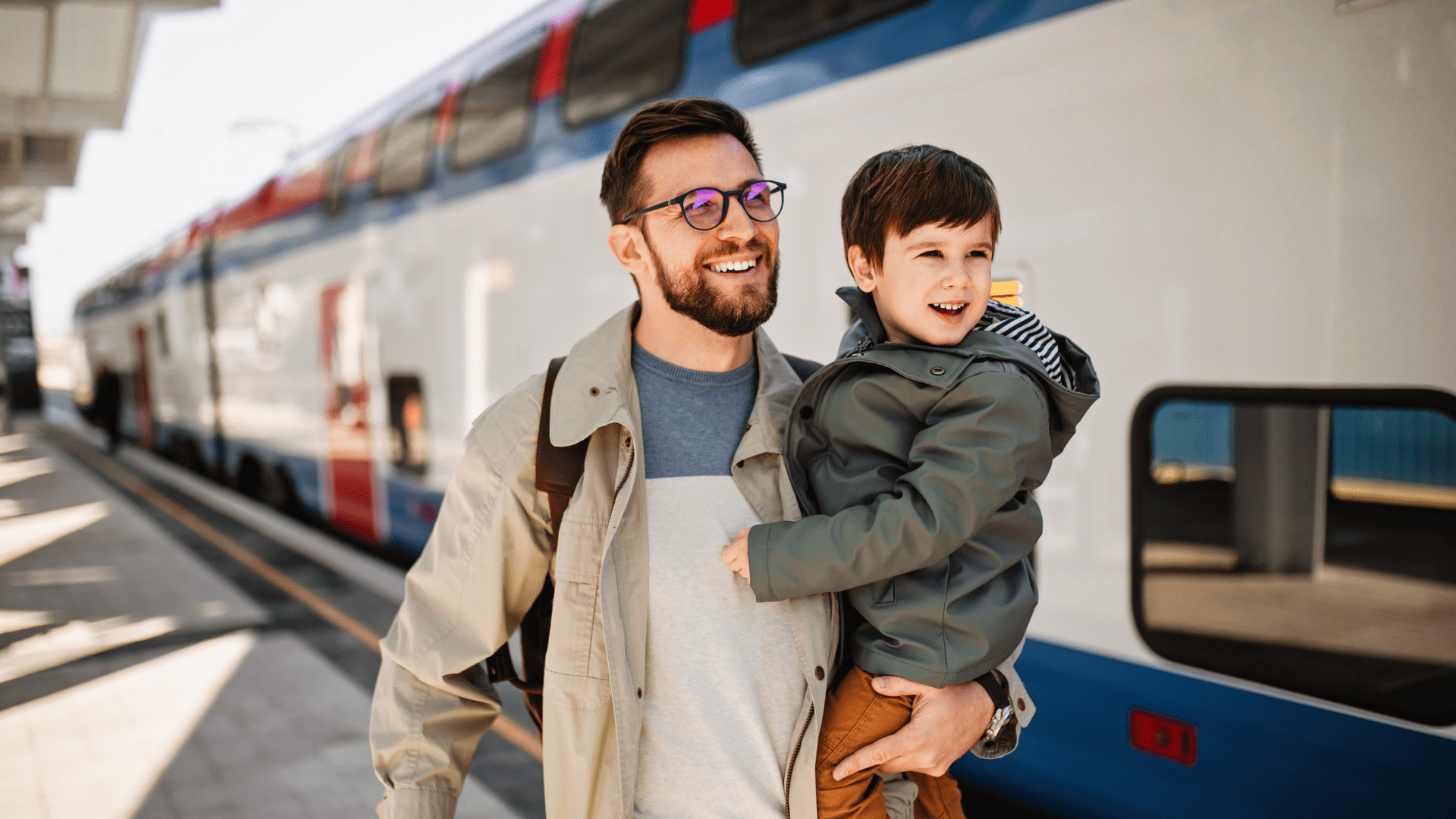 A father and a son are taking the train