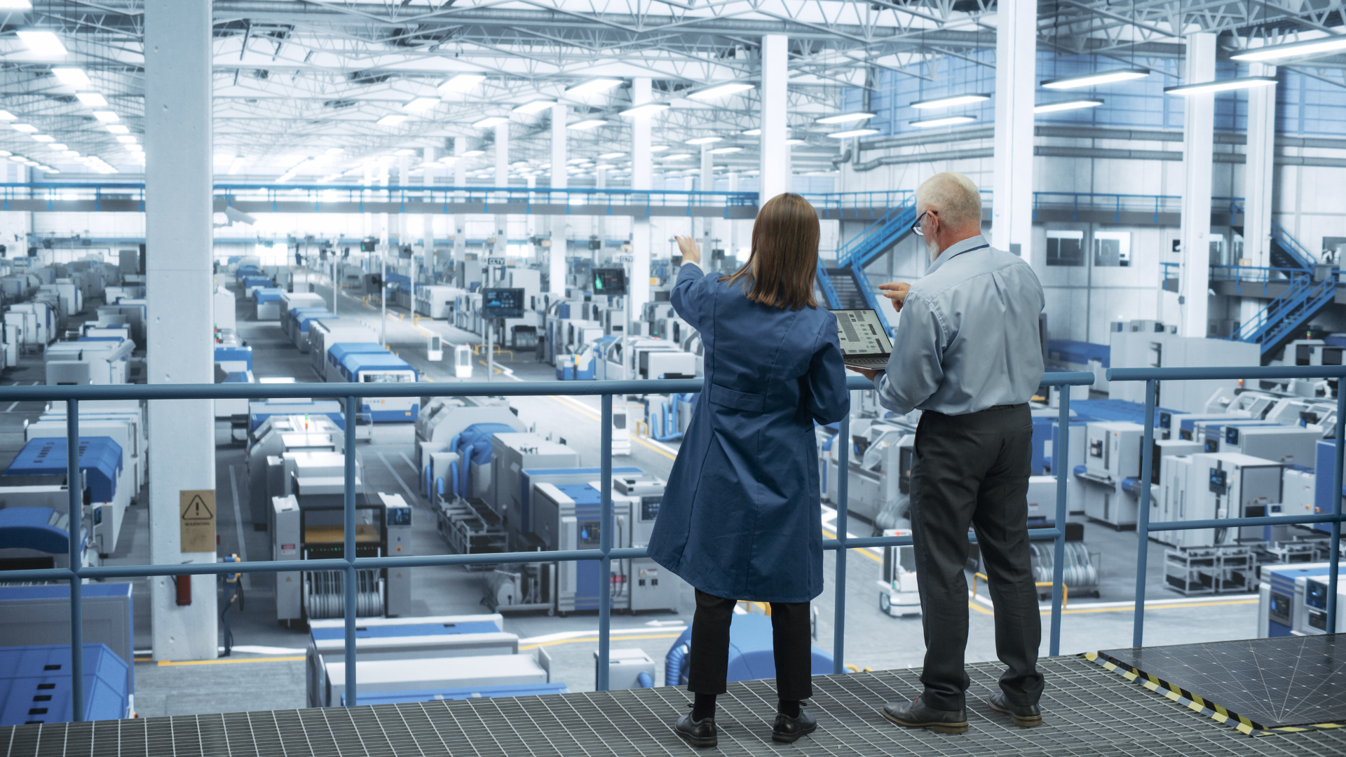 Engineers looking over a manufacturing facility