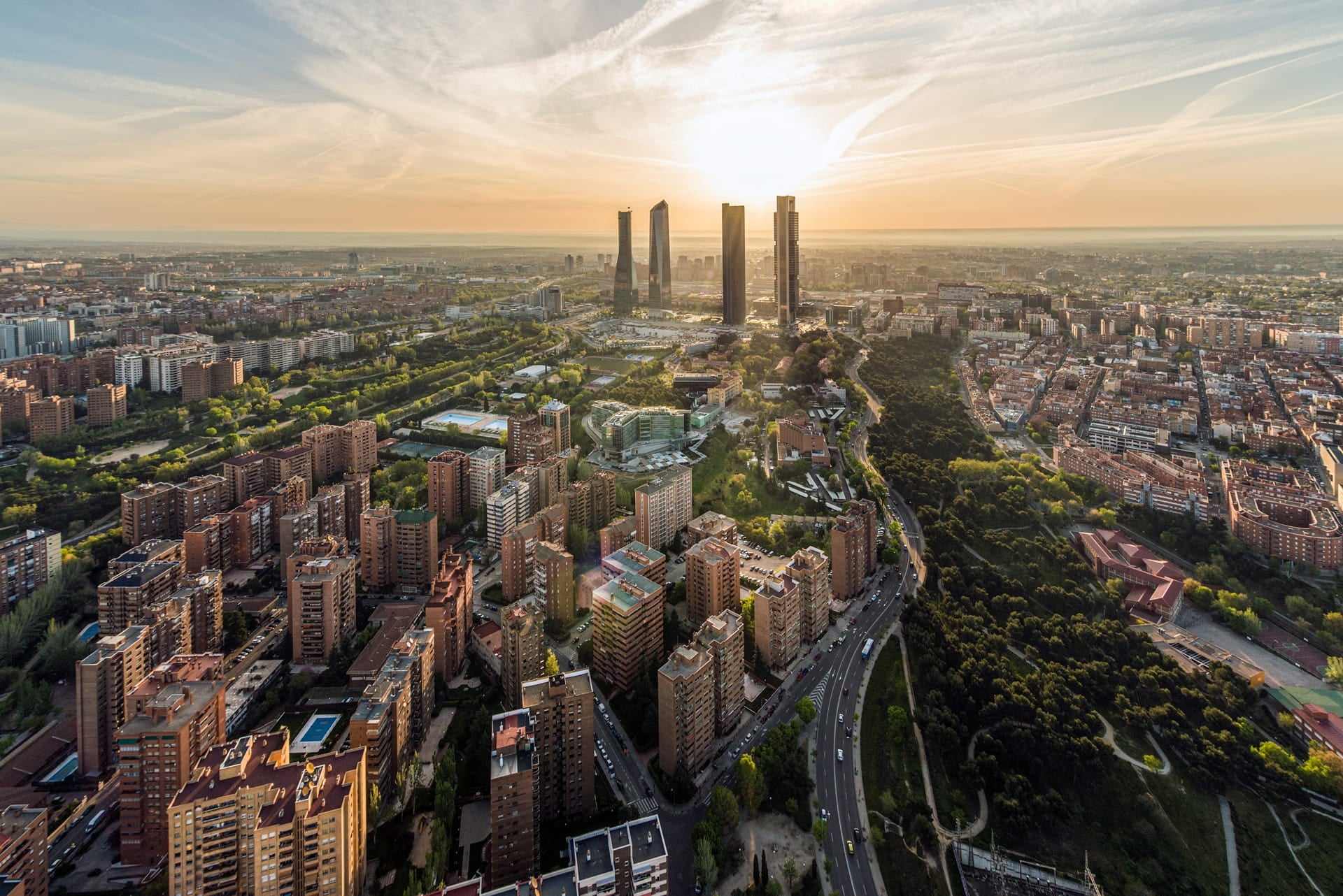 Aerial view of Madrid’s urban landscape with modern high-rise buildings and green corridors, illustrating Spain’s role as a leading data centre hub in Southern Europe.