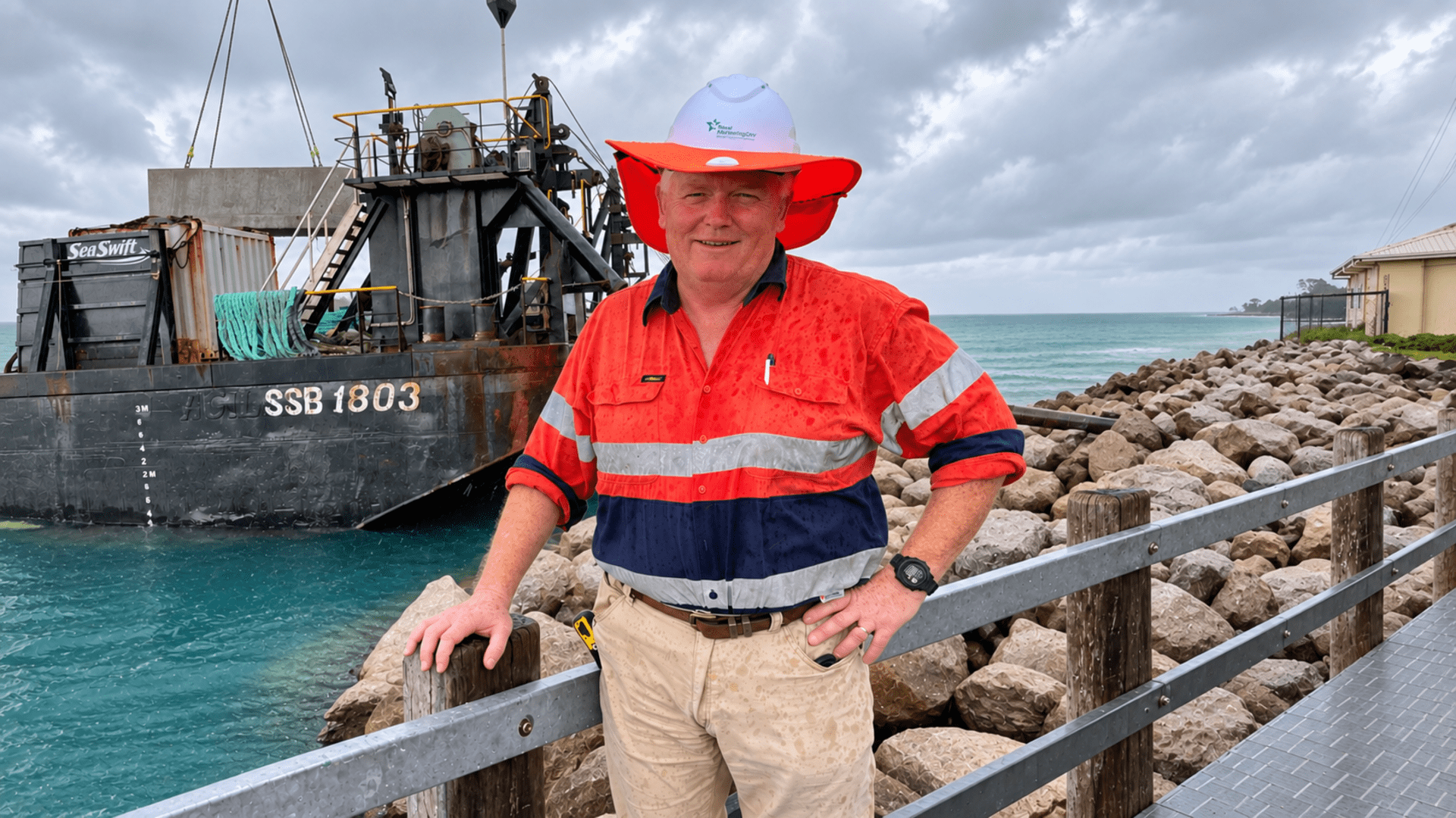 Stuart Bettington inspecting coastal barrier construction on Iama.