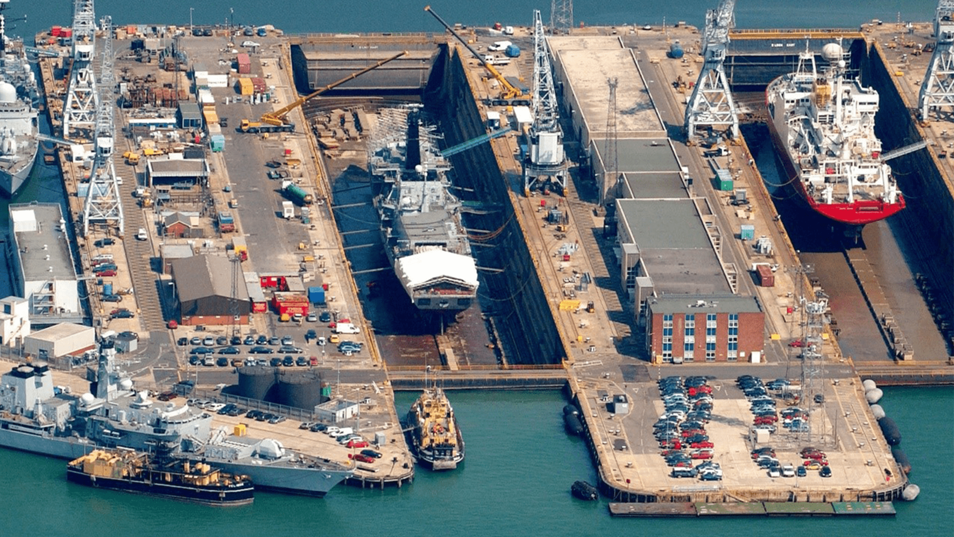 Overview of a naval shipyard showing the different naval assets
