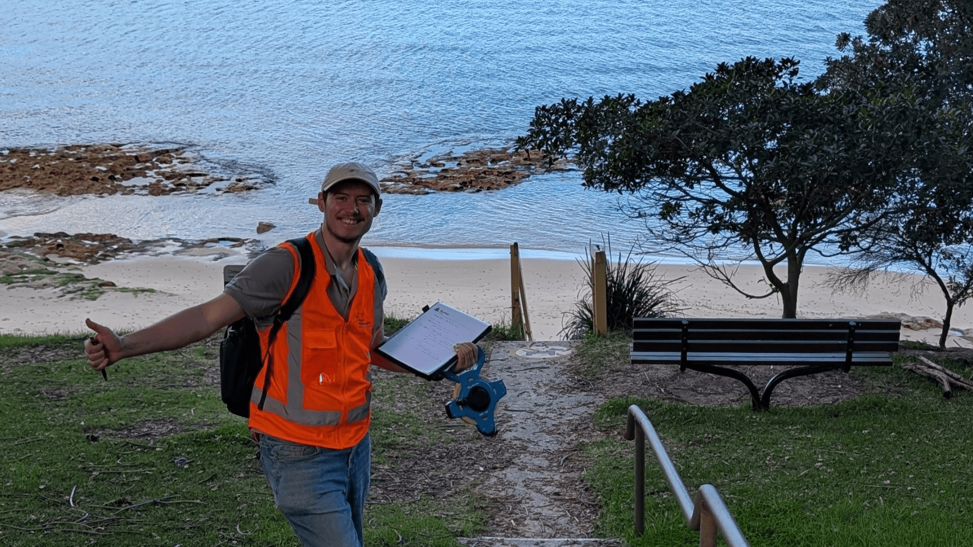 Thomas Wright standing in front of coast