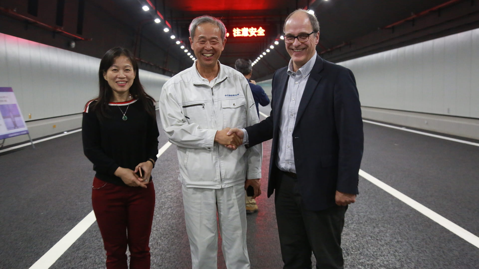 Ying Li (left) and Hans de Wit (right) with Mr. Lin Mign (middle), General manager of HZMB Island and Tunnel Project, at the Macau Bridge (HZMB) Fixed Link in Hong Kong.