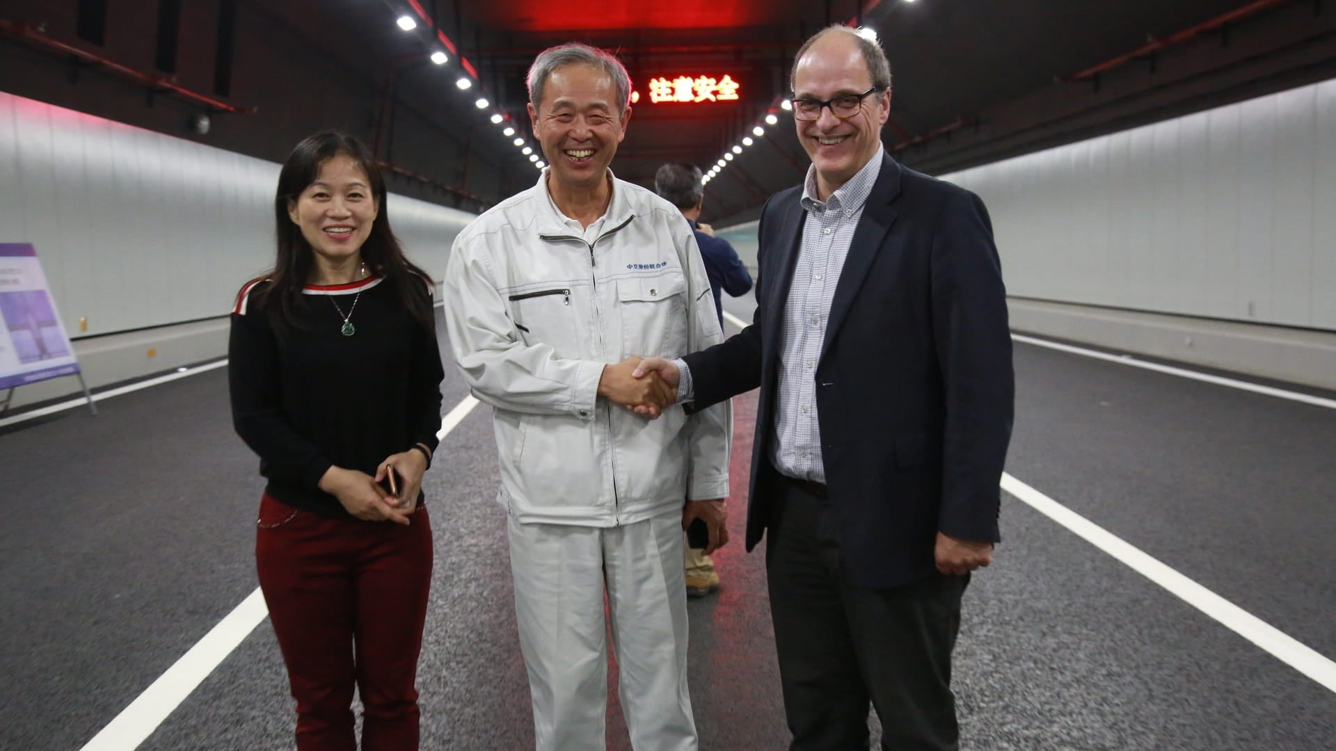 Ying Li (left) and Hans de Wit (right) with Mr. Lin Mign (middle), General manager of HZMB Island and Tunnel Project, at the Macau Bridge (HZMB) Fixed Link in Hong Kong.