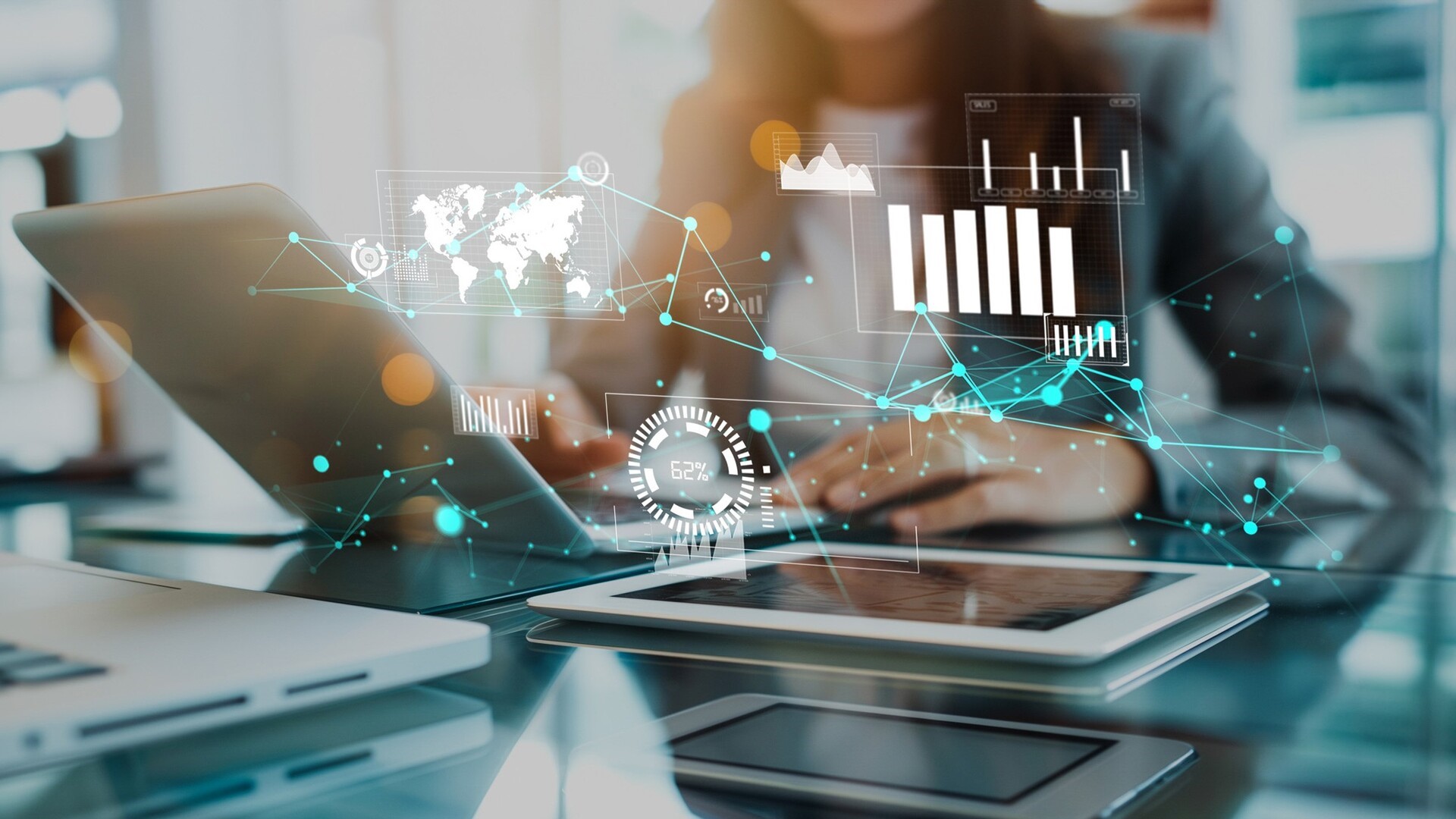 Woman working on laptop with data overlay