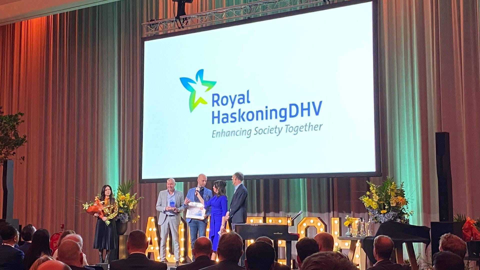 The Aurea team on stage receiving the award