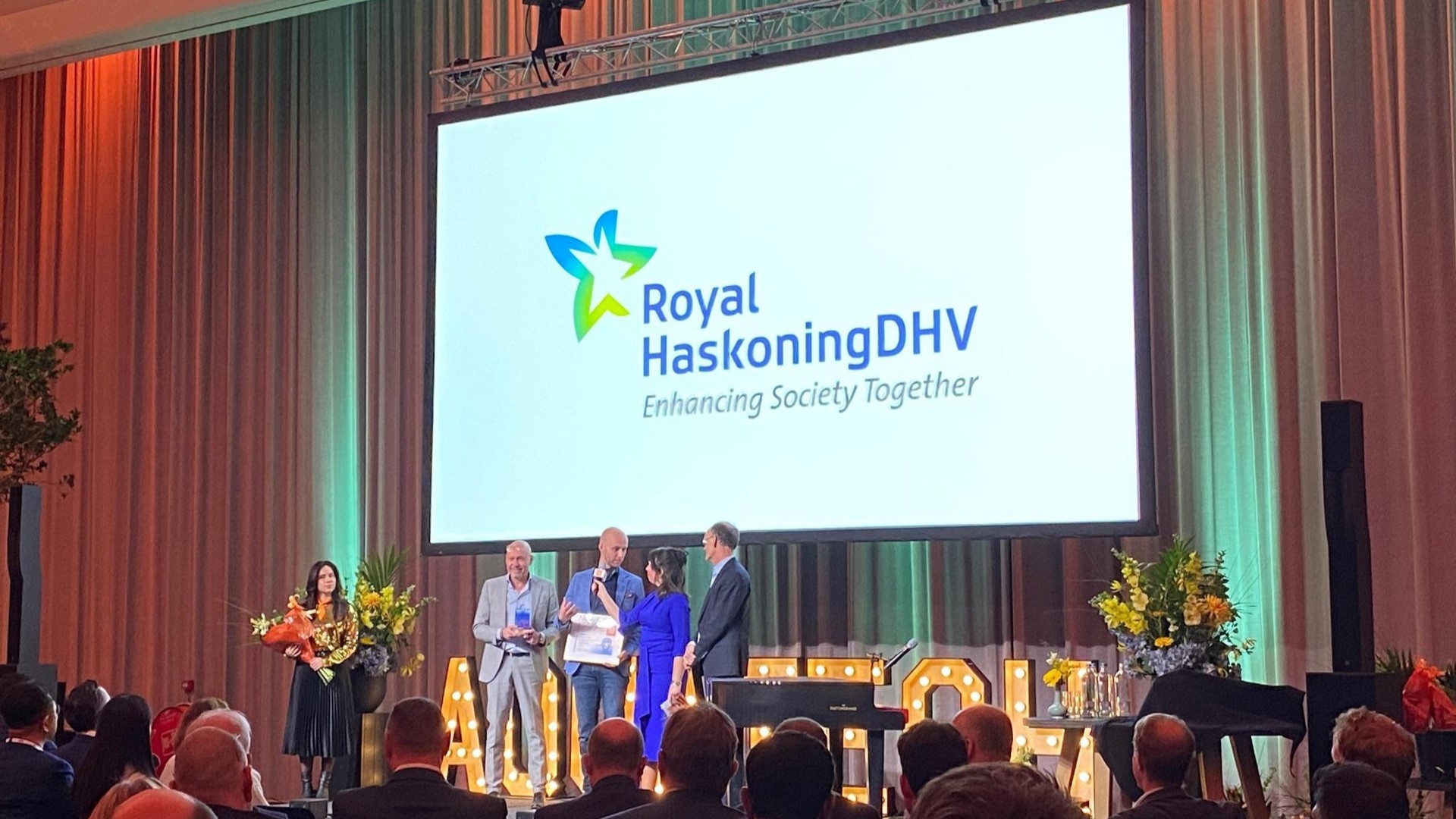 The Aurea team on stage receiving the award