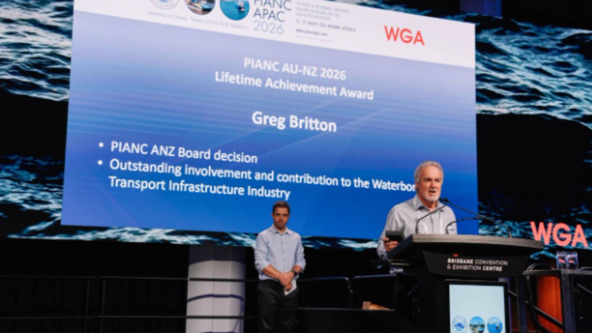 Award presentation recognising Greg Britton with the PIANC APAC 2026 Lifetime Achievement Award for outstanding contributions to the waterborne transport infrastructure industry.