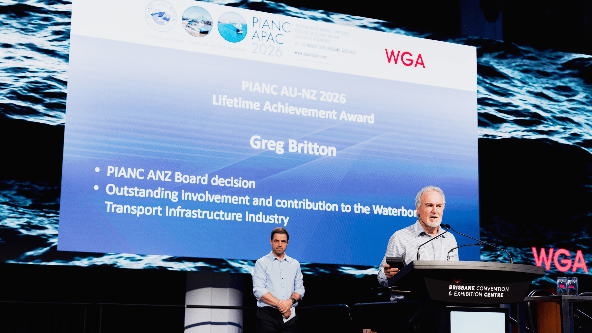 Award presentation recognising Greg Britton with the PIANC APAC 2026 Lifetime Achievement Award for outstanding contributions to the waterborne transport infrastructure industry.
