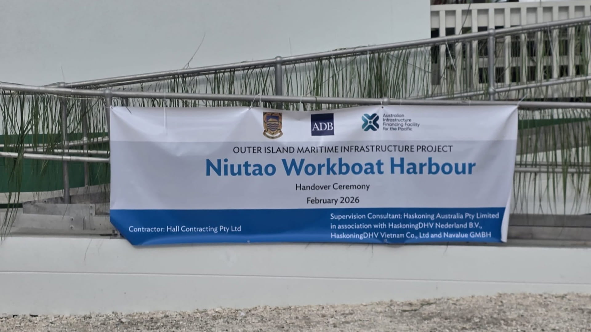 a banner announcing the opening of Niutao harbour in Tuvalu