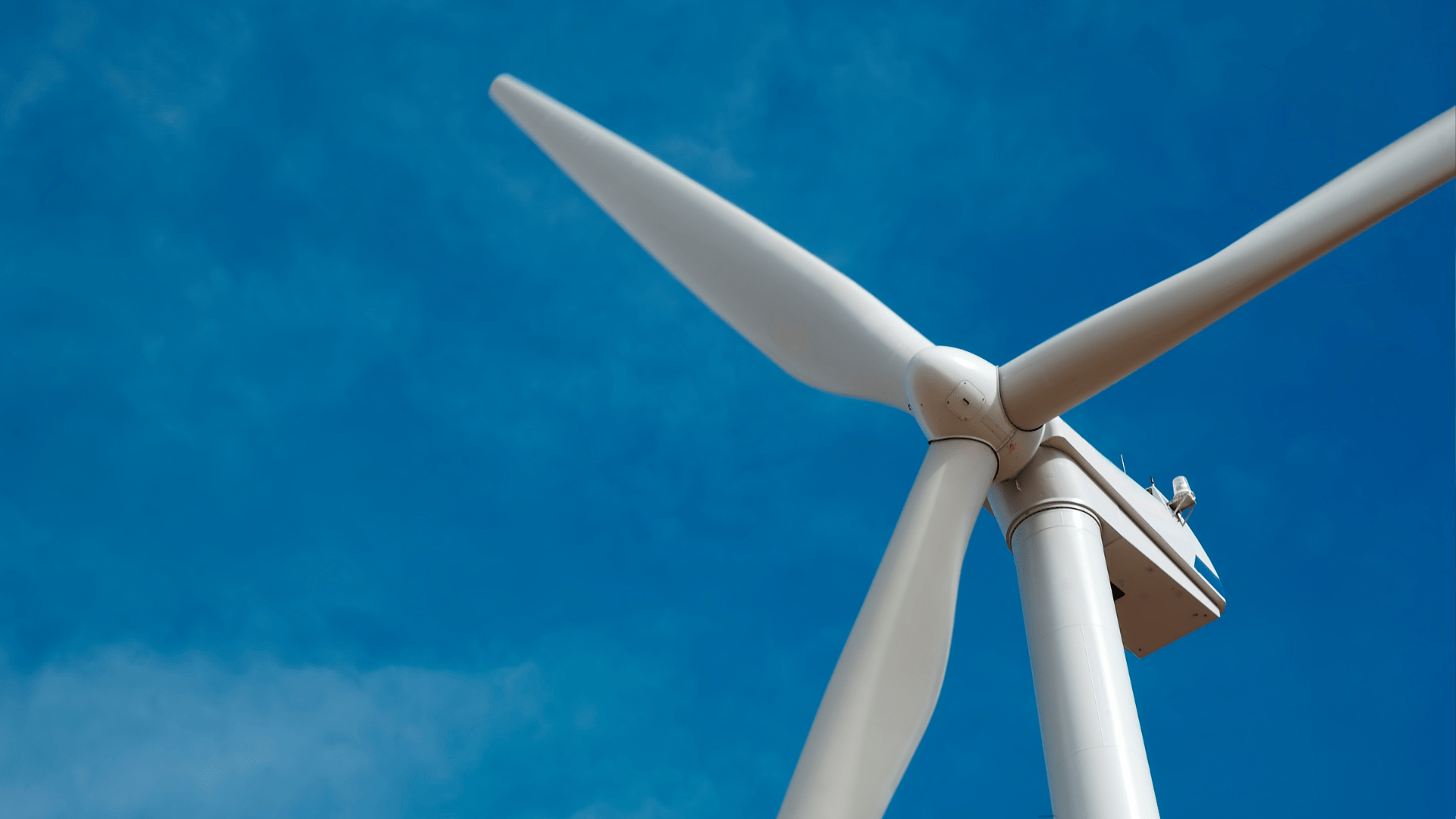 offshore wind turbine with a blue sky