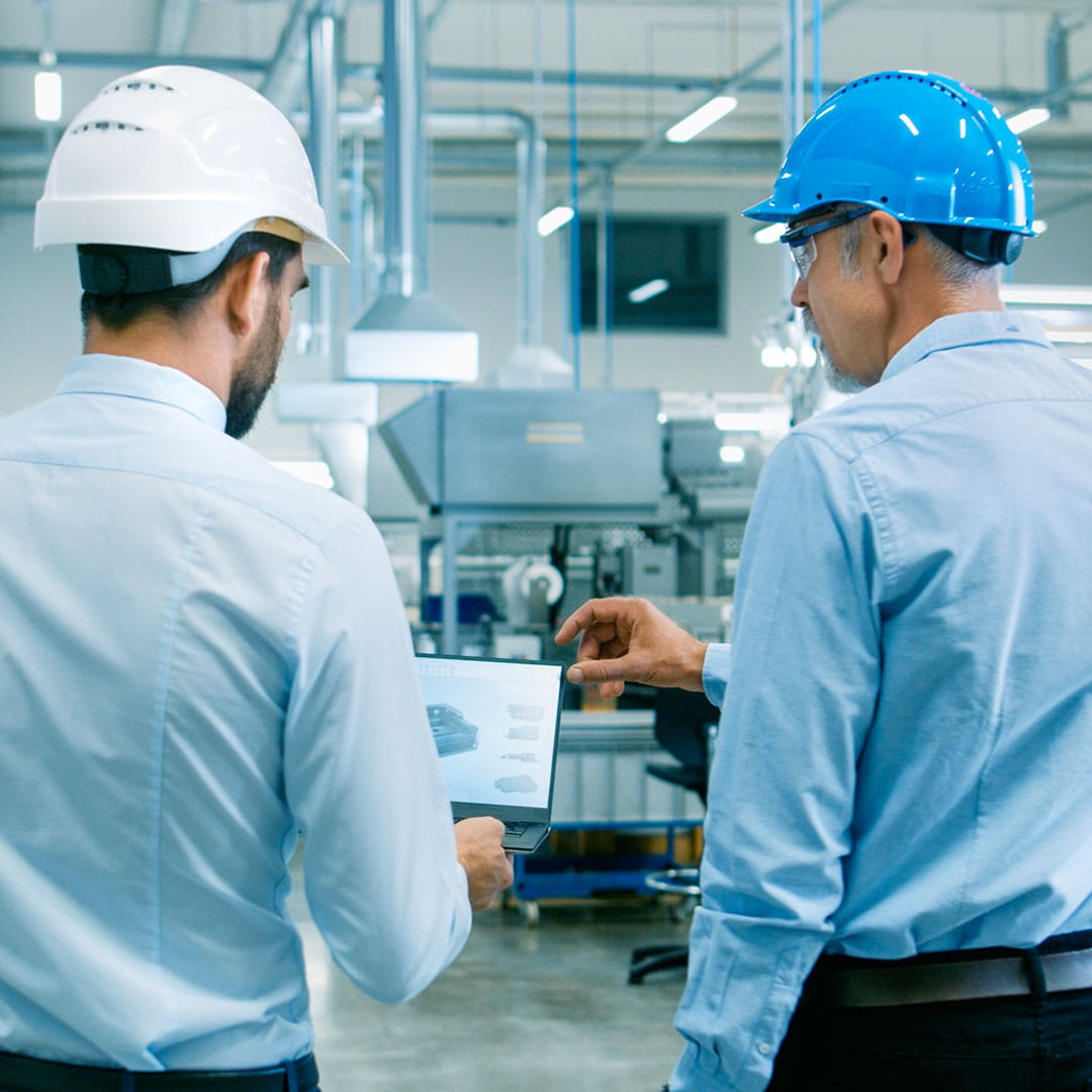 Men in factory setting