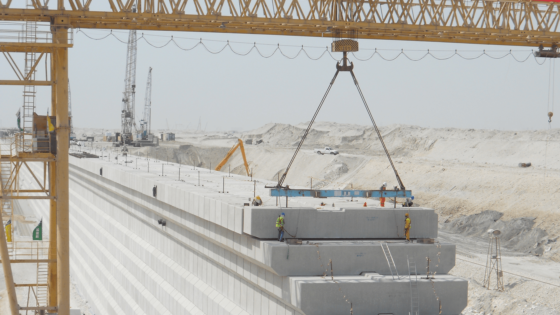 the last precast concrete block being placed in the quay walls