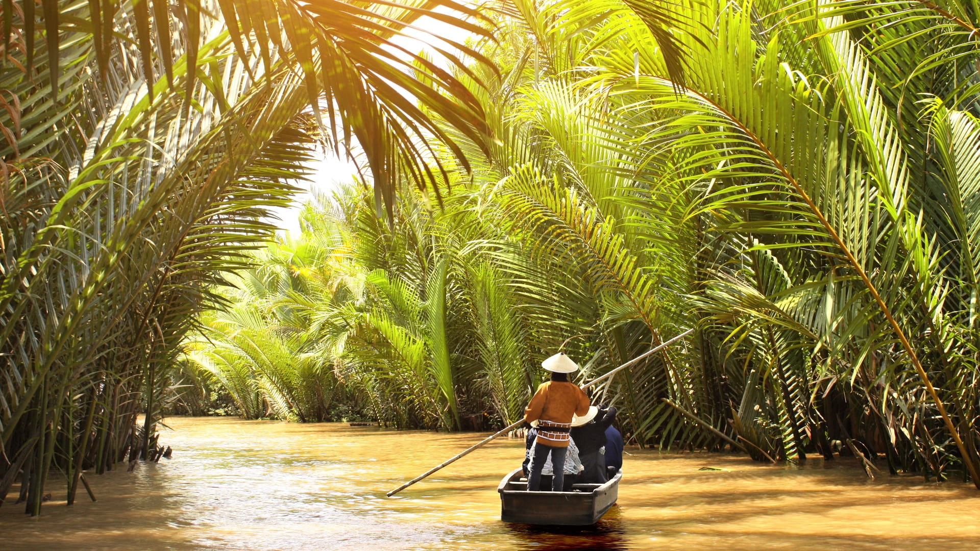 People boating in the delta of Mekong river, Vietnam.