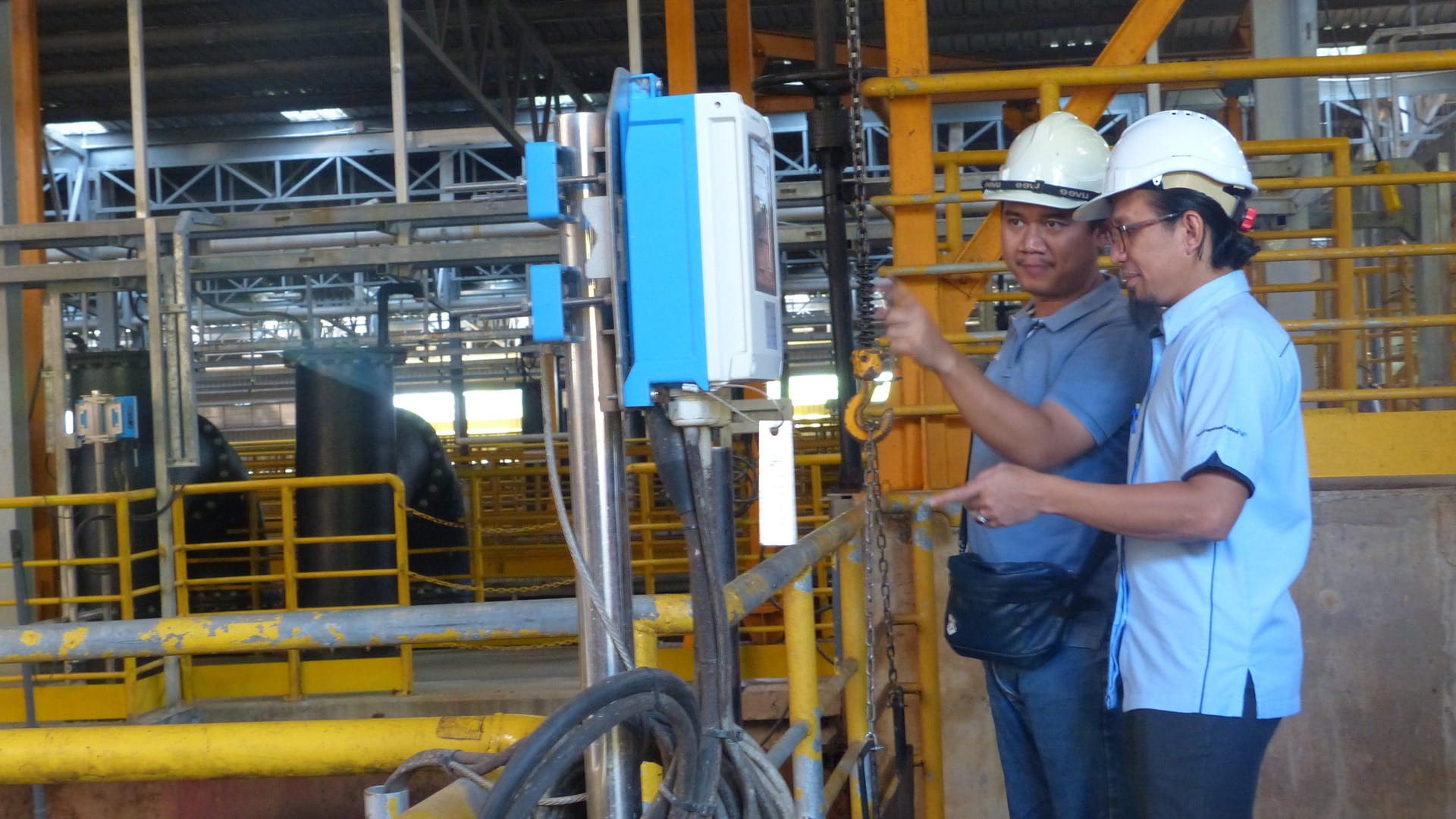 Two men from WOP4R partnership in a water plant