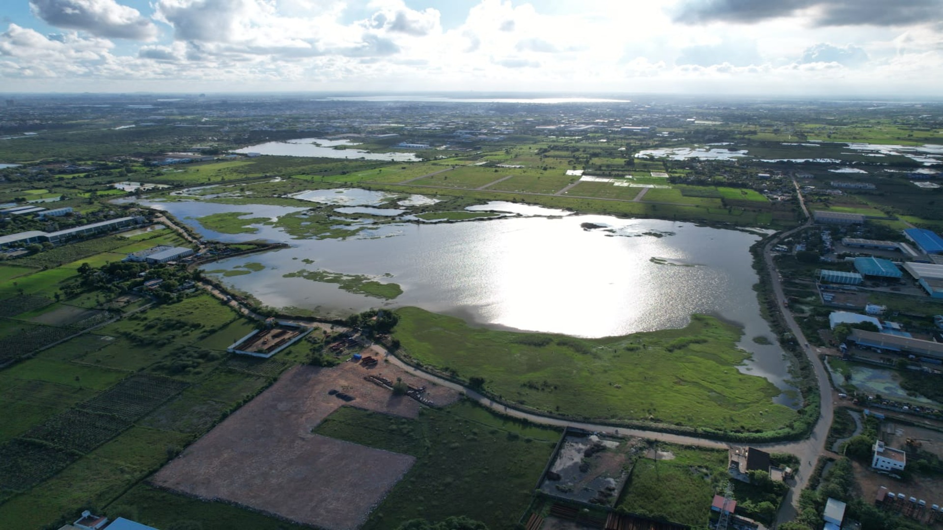 Aerial view of the Kosasthalaiyar Basin area in Chennai before intervention, showing flood‑prone urban land and water bodies historically affected by high flood risk, groundwater depletion and biodiversity loss.
