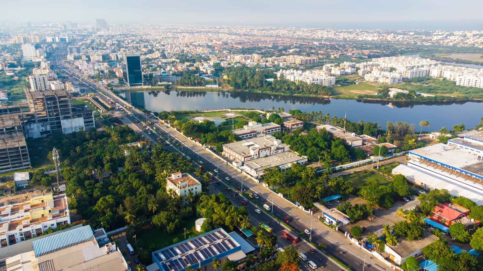 Aerial view of urban flood management infrastructure in Chennai’s Kosasthalaiyar Basin, integrating waterways, green spaces and sustainable drainage systems.