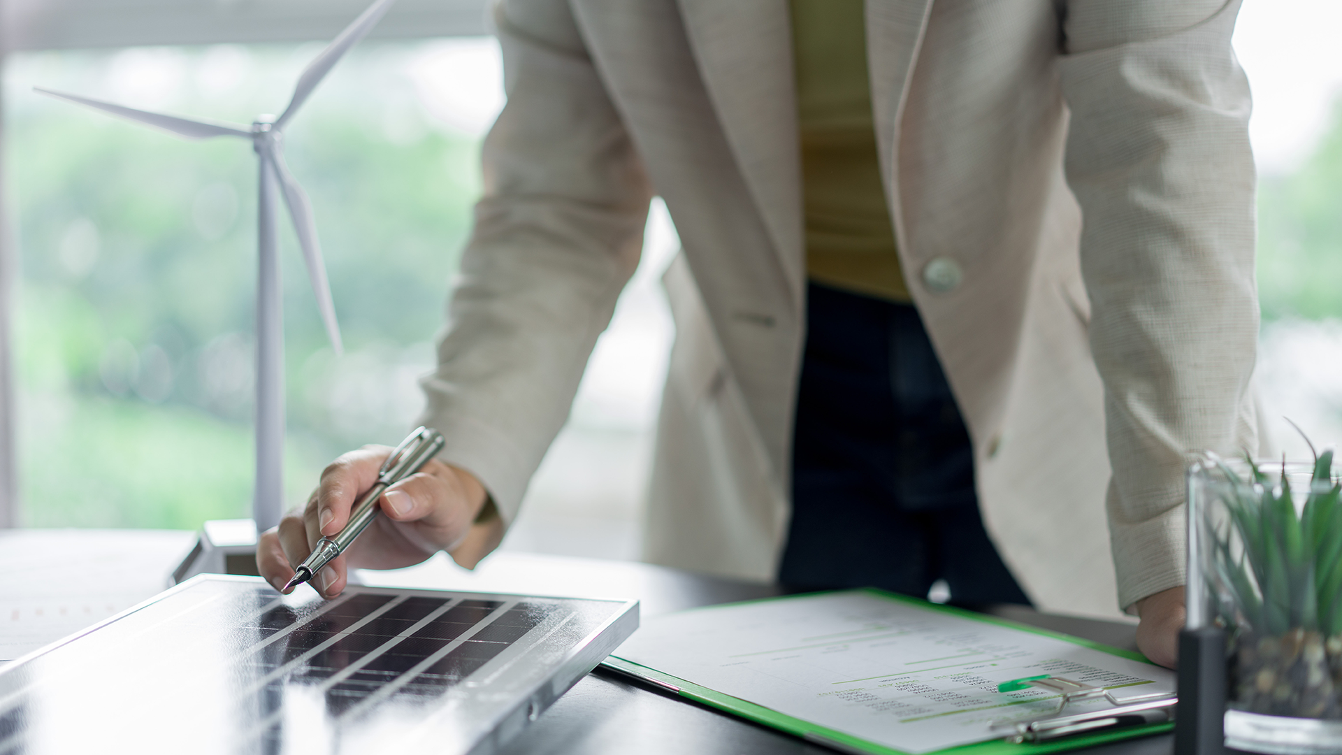 Person working on documents on a table