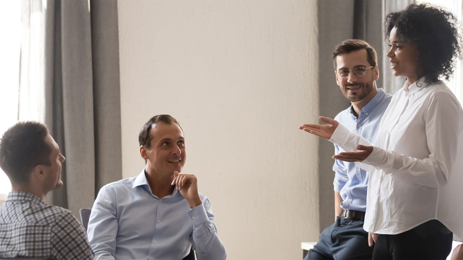 People at the office having a conversation