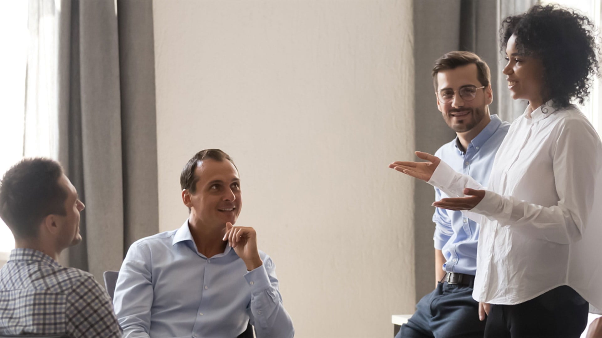 People at the office having a conversation