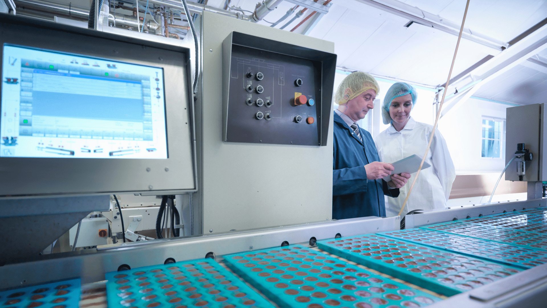 Industrial project delivery in food manufacturing plant with process engineers reviewing production line performance, highlighting integrated engineering, process optimisation and efficient execution of industrial capital projects