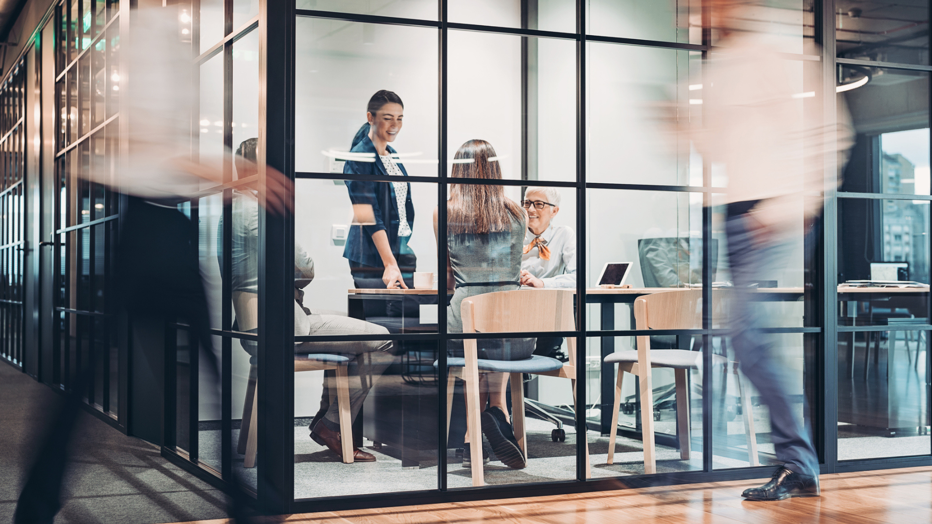 Team collaboration on industrial investment decisions, combining strategic, financial and engineering expertise in a modern office setting.