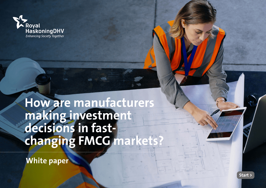 A woman and a man discussing business case consulting while wearing safety vests at a table, emphasizing their focus on strategy consulting and project management in a collaborative environment