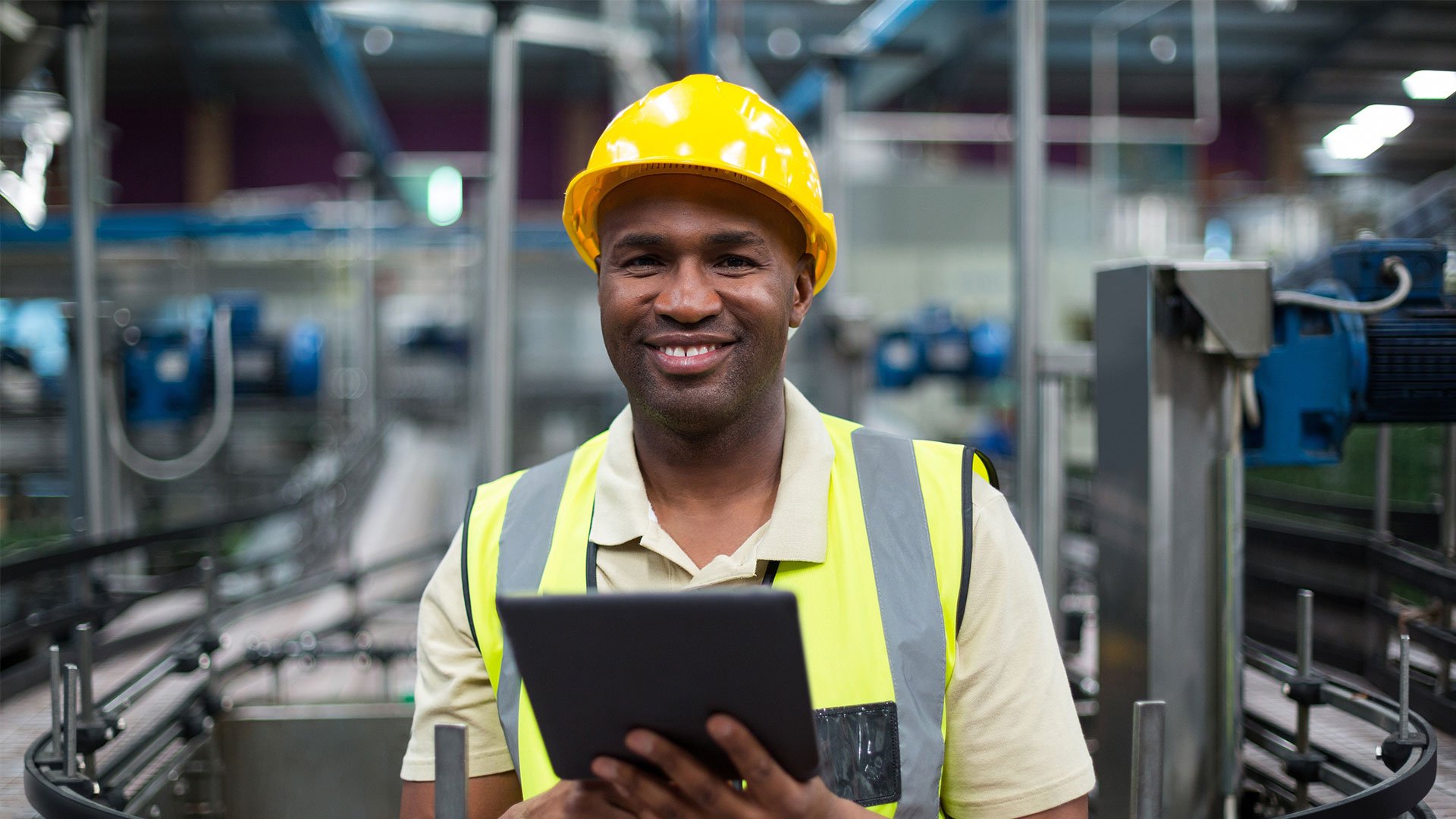 Man in a manufacturing facility, emphasizing industrial engineering and future advanced manufacture processes