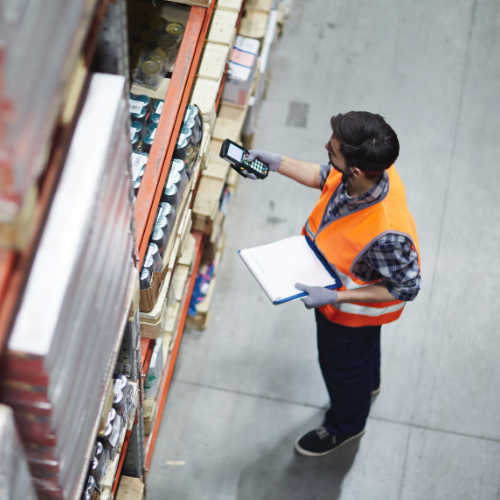Man in a warehouse for industry and supply chain