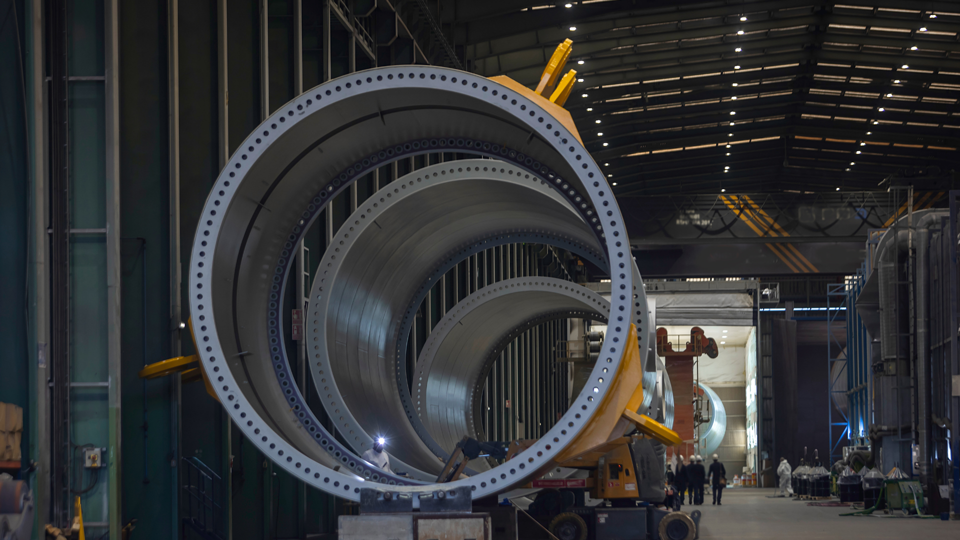 Wind turbine components in a manufacturing facility.