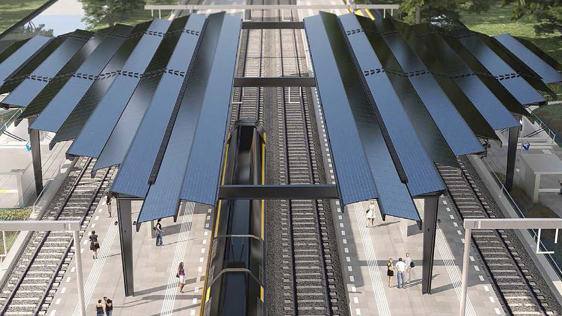 two railway platforms with a stationary train in the middle.