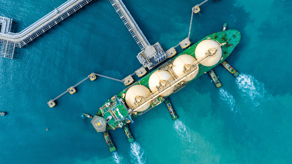 An LNG tanker anchored at a terminal.