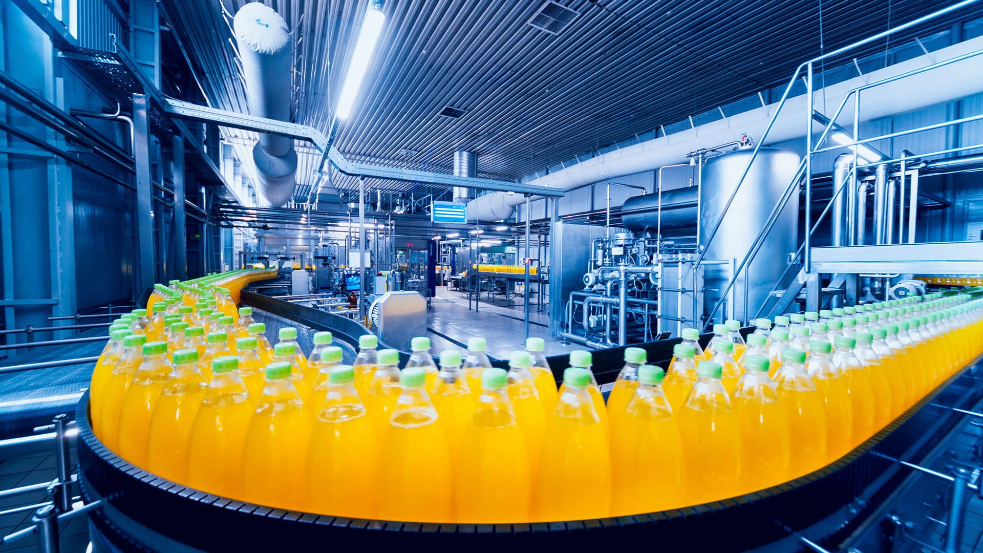 Factory belt with bottle of juice